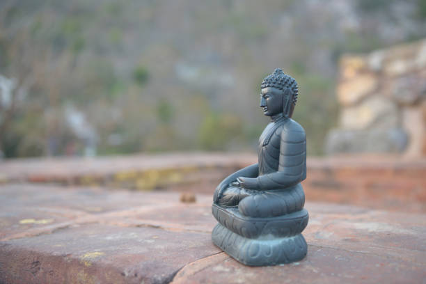 Glass transparent ball on back view of Buddha Statue with mountain at Wat Phasornkaew in Thailand. Photo taken on: 29 November , 2016