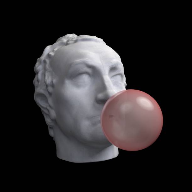 istock Funny illustration from 3d rendering of classical head sculpture blowing a pink chewing gum bubble. Isolated on black background 1221520453