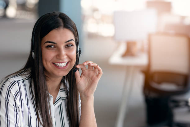 istock Happy smiling woman working in call center 1221525084