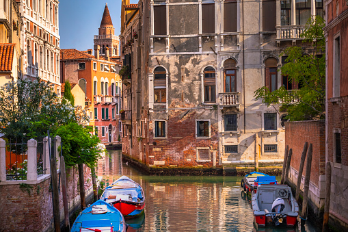 Venetian boats on water Canal - Venice, Italy