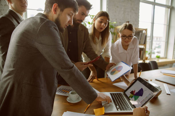 istock Group of young business professionals having a meeting, creative office 1221525208