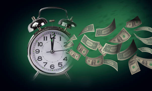 istock time clock dollars flying loss damage profit market 1221529496