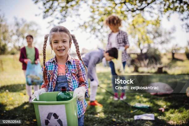 Family Cleaning Up The Forest Stock Photo - Download Image Now - Recycling, Child, Garbage