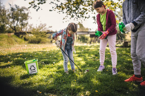 istock Family cleaning up the forest 1221533152