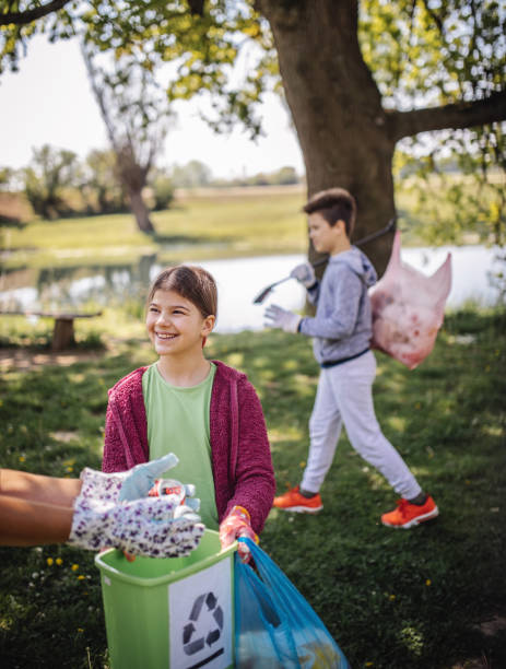 istock Family cleaning up the forest 1221534029