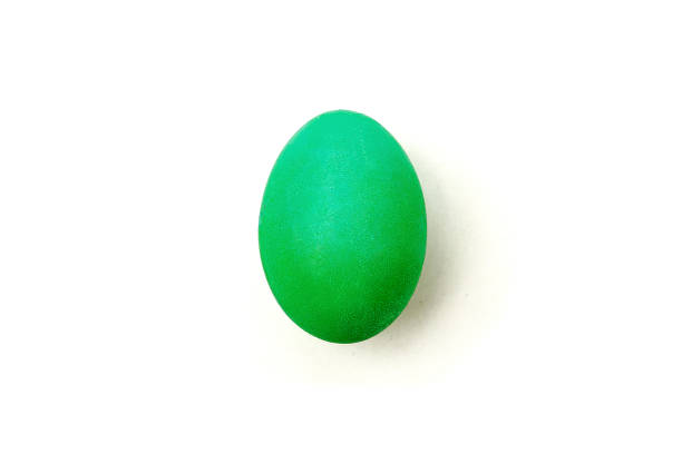 istock Green painteded chicken egg isolated on the white background. 1221535770