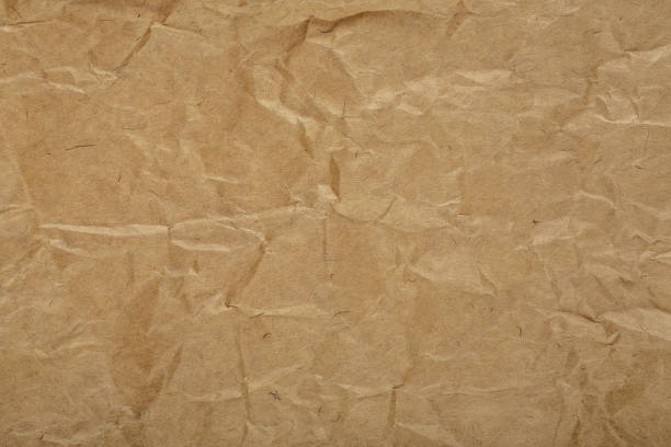 istock Close up of brown crumpled paper texture background 1221535995