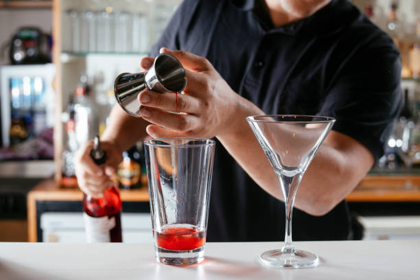 istock Expert barman making cocktail at nightclub. 1221537183