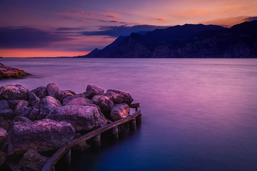 Lake Garda and Trentino Alpine landscape near Malcesine at sunset, Italy