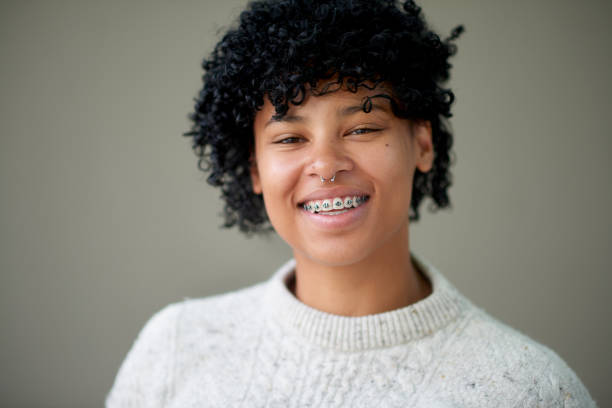 Confidence is about being the most authentic version of me Studio portrait of a young woman standing against a grey background septum piercing stock pictures, royalty-free photos & images