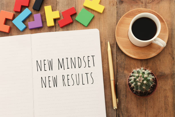 istock top view image of table with open notebook and the text new mindset new results. success and personal development concept 1221548317