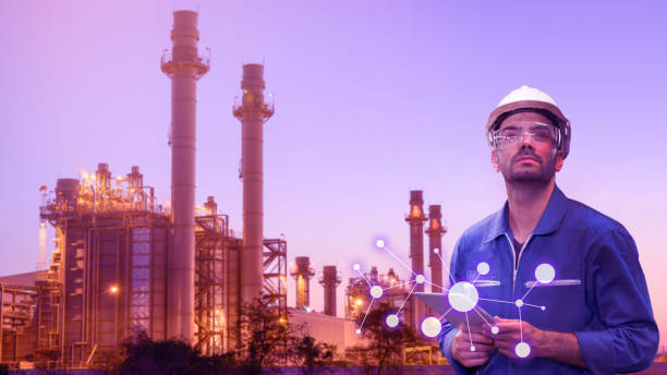 istock Caucasian man engineer staff worker with tablet in hand and power plant background concept. 1221549512
