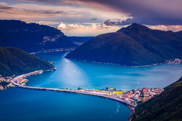 Above Lake Lugano at sunset and swiss alps landscape – Ticino, Switzerland Above Lake Lugano at sunset and swiss alps landscape – Ticino, Switzerland lepontine alps stock pictures, royalty-free photos & images