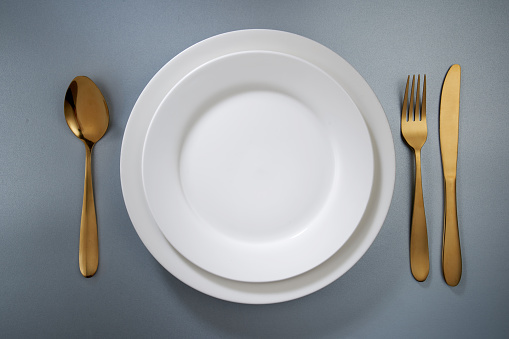 top view dinner plate and eating utensil