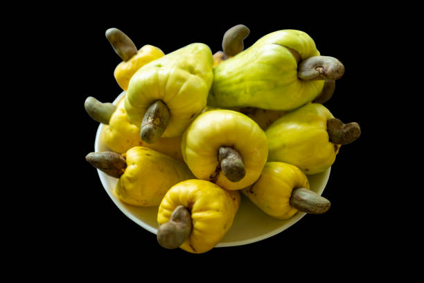 istock Yellow cashew fruits in white dish 1221551121