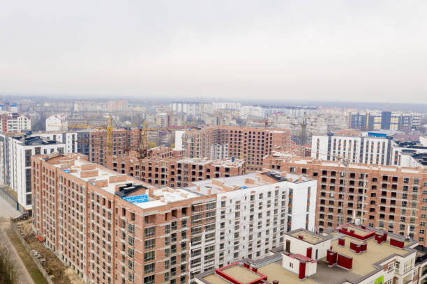 istock High-rise multi-storey buildings under construction. Tower cranes near building. Activity, architecture, development process. 1221552145