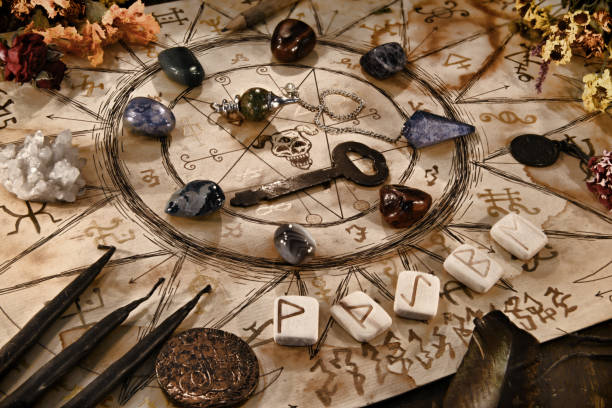 istock Manuscript with witch drawings, key, black candles and runes. 1221553551