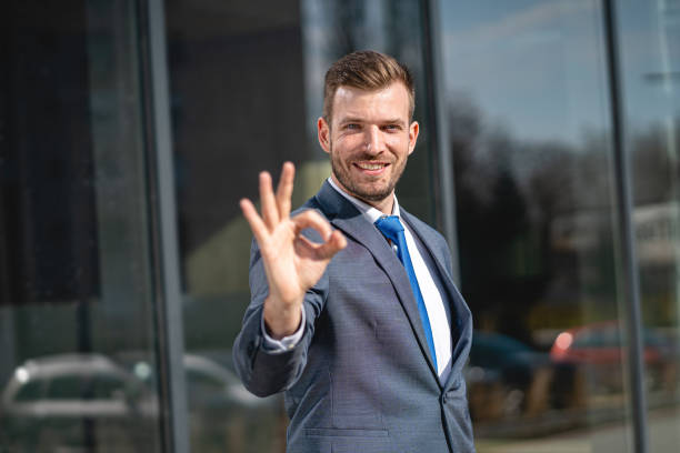 istock Satisfied businessman showing OK sign 1221553705
