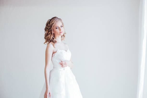 istock beautiful bride posing wedding hairstyle and dress 1221554353