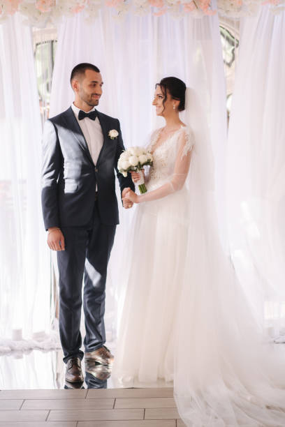 istock Groom and bride read their wedding vows. Love each other 1221555379