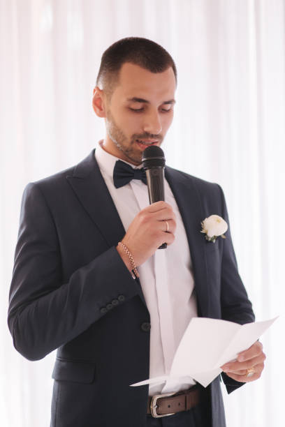 istock Handsome groom reading wedding vows and started crying. Groom have feeling of overwhelming love for bride 1221555394