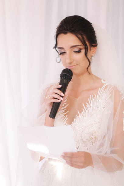 istock Groom and bride read their wedding vows. Love each other 1221555410