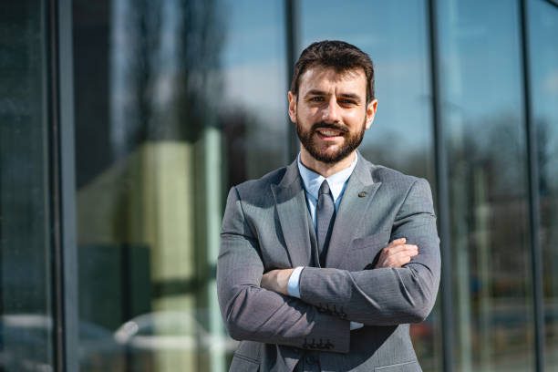 istock Smiling businessman looking at camera 1221555475