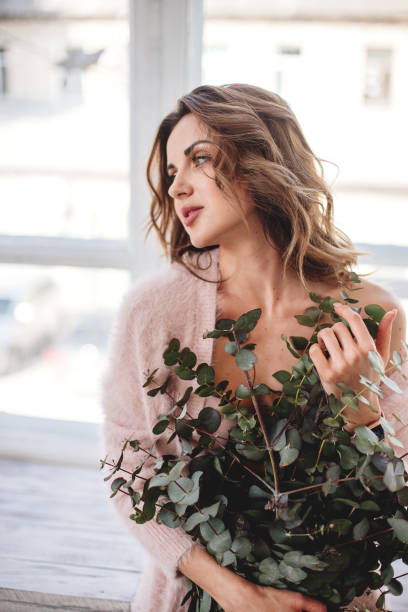 istock Beautiful girl by the window. 1221560837