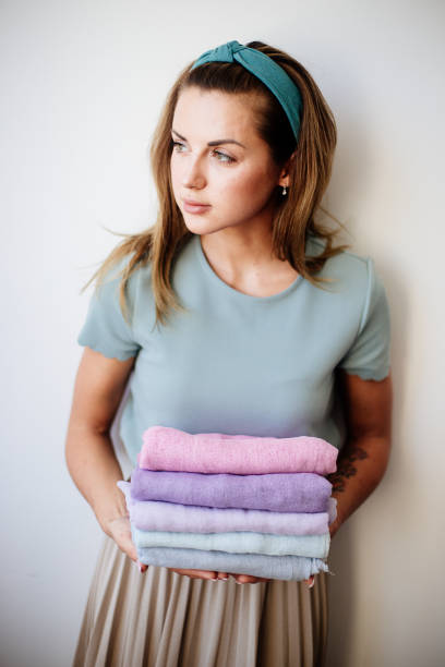 istock Florist with colored gauze in hands. 1221560907
