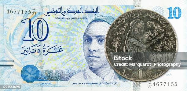 1 Tunisian Dinar Coin Against 10 Tunisian Dinar Bank Note New Edition Stock Photo - Download Image Now