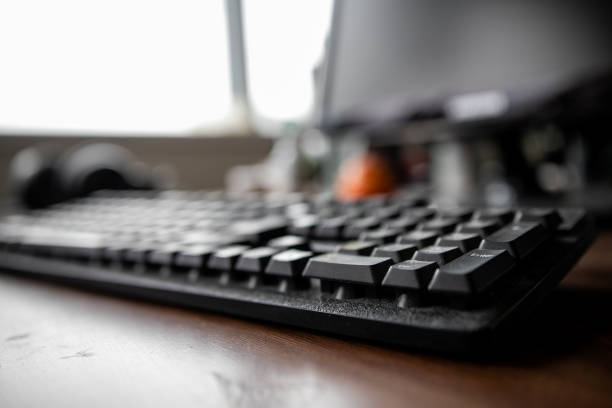 istock White computer table and black keyboard. Business concepts. Offices lifestyles. 1221563399