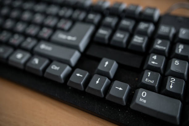 istock White computer table and black keyboard. Business concepts. Offices lifestyles. 1221563421
