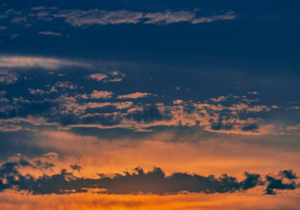 istock Scene with sunset on a summer afternoon with clouds 1221563453