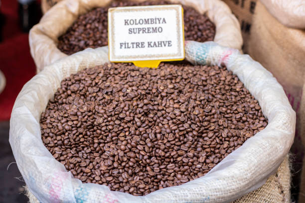 istock Raw coffee grains in sacks close up. 1221563476