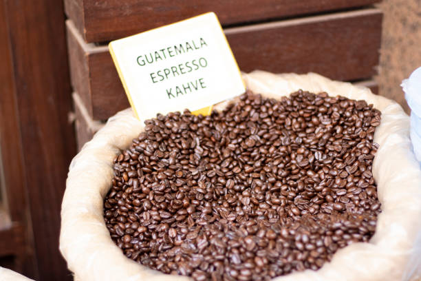 istock Raw coffee grains in sacks close up. 1221563630