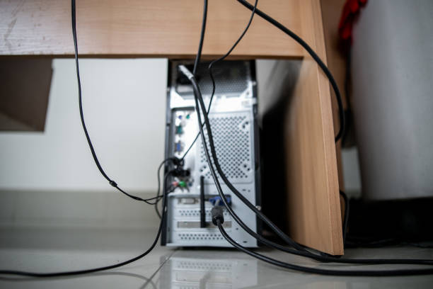istock Concept of clutter in office. Unwound and tangled electrical wires under the table. 5S system of lean manufacturing 1221563893