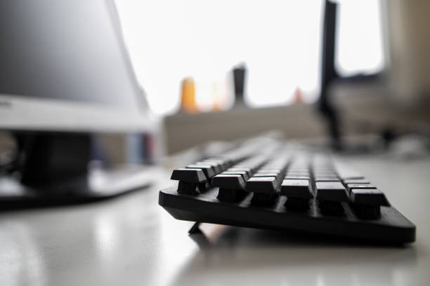 istock White computer table and black keyboard. Business concepts. Offices lifestyles. 1221564078