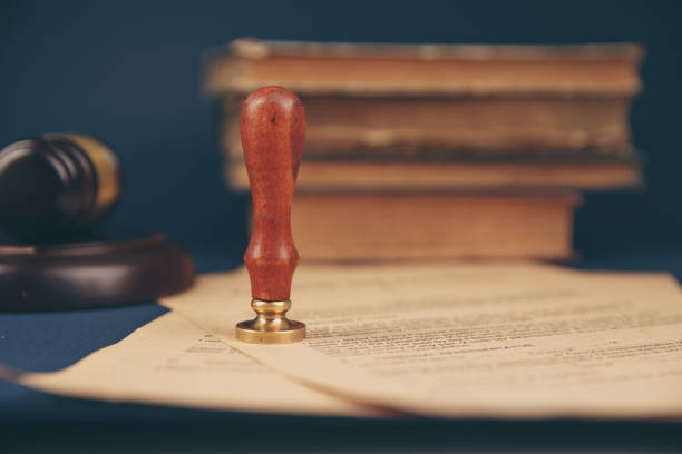 istock Notary's public pen and stamp on testament and last will. Notary public 1221564381