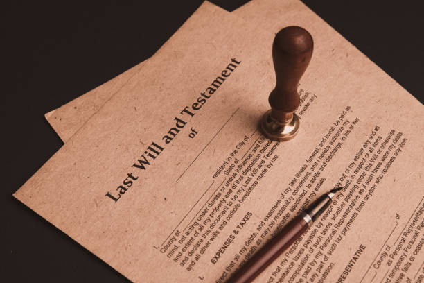 istock Notary's public pen and stamp on testament and last will. Notary public 1221564510