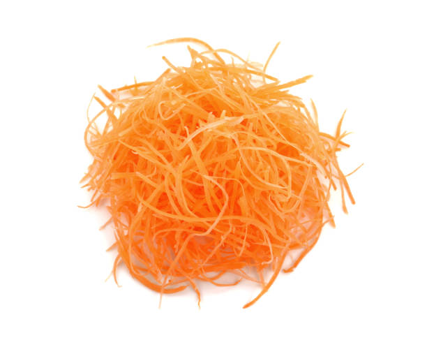 istock Fresh shredded carrots isolated on white 1221565752