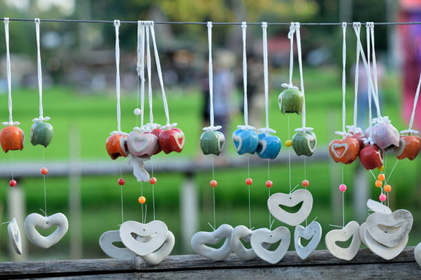 istock Colorful hanging mobile aganist blurred nature background 1221565828