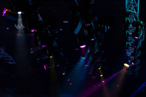 istock lights spotlights and smoke over the stage 1221568061