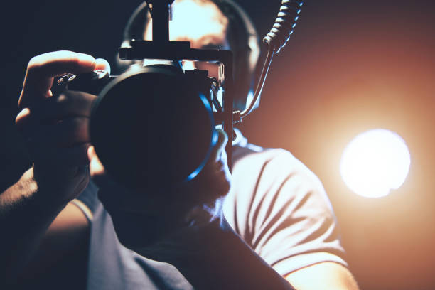 istock Videographer with Professional DSLR Camera in Hands 1221568789