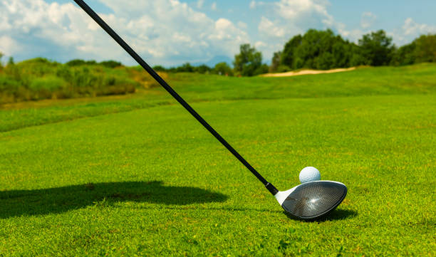 istock Close up Golfer is driving golf ball to green course 1221569180