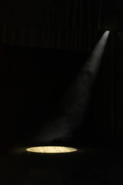 istock Theater lights spotlights and smoke over the stage 1221569723