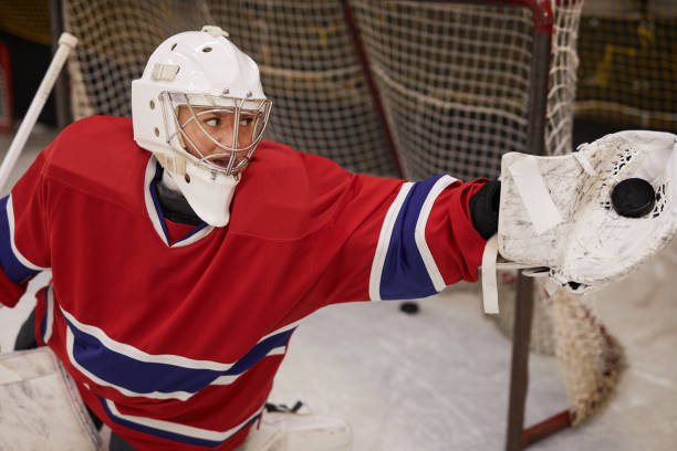 istock Female Hockey Player Defending Gate 1221570608