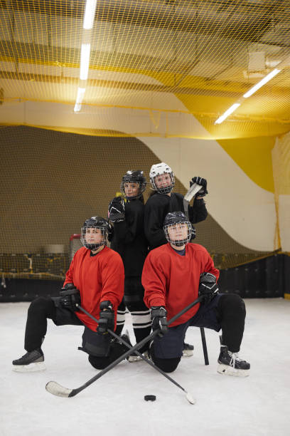 istock Female Hockey Team Posing on Ice 1221570620