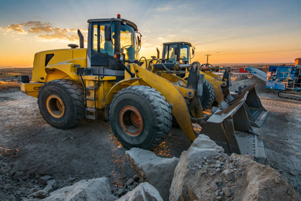 istock Group of excavators in a rock and stone quarry 1221572436