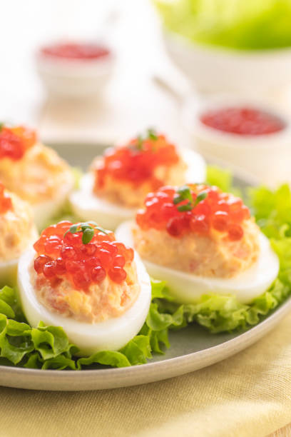 istock Stuffed eggs with red caviar. Traditional festive Russian snack. 1221572711