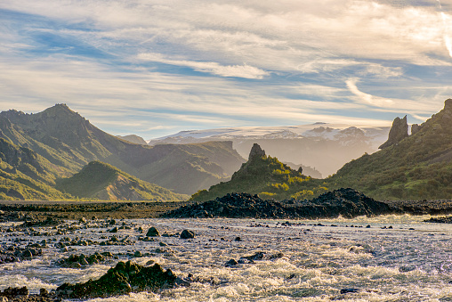 Krossá river flowing through the valley  in Iceland during a beautiful summer afternoon. Landscape photo of the dramatic nature in Iceland.